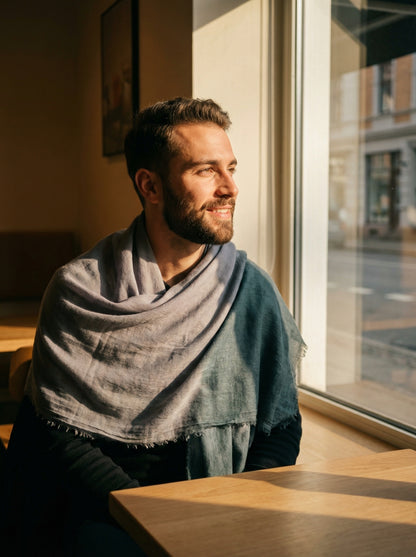 Man wearing Dyed Taupe Grey Moroccan Tagelmust as a breathable desert headscarf, lightweight safari scarf built for Sahara trekking, dust protection, and hot weather travel.