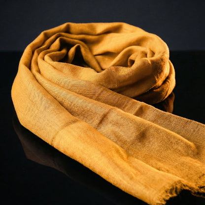 Lightweight Original Sunglow Orange Tagelmust crafted in sustainably sourced rayon fabric, breathable Moroccan desert headscarf designed for Sahara travel, safari protection, and hot climate exploration.