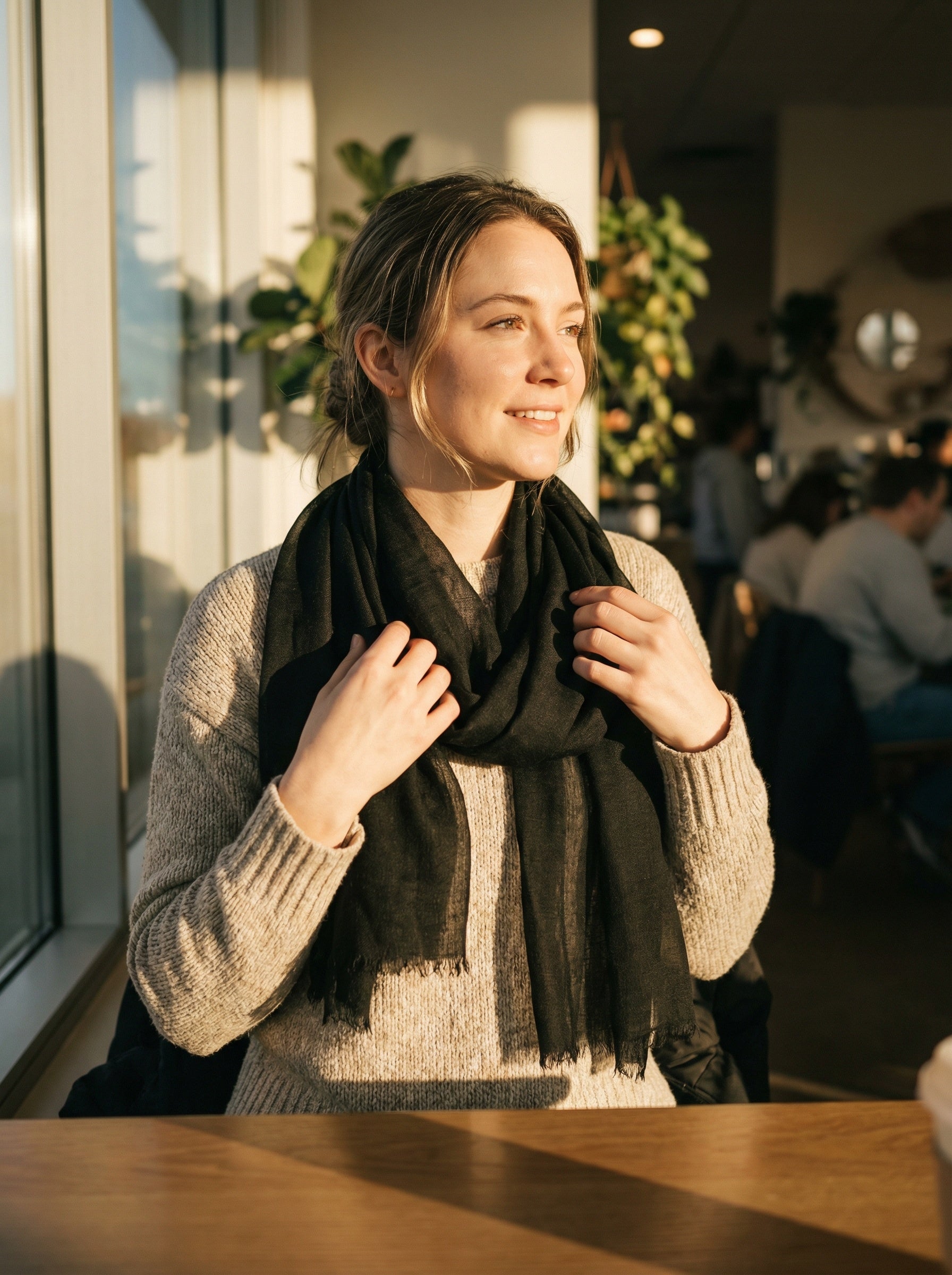 Smoke black Tagelmust styled as a lightweight travel scarf for women, Touareg inspired Moroccan headscarf ideal for safari adventures and warm desert climates.