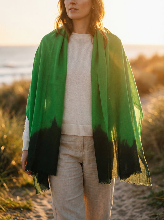 Green Tagelmust styled as a lightweight travel scarf for women, Touareg inspired Moroccan headscarf ideal for hot climate exploration.