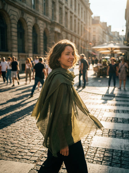 Green Tagelmust styled as a lightweight travel scarf for women, Touareg inspired Moroccan headscarf ideal for hot climate exploration.