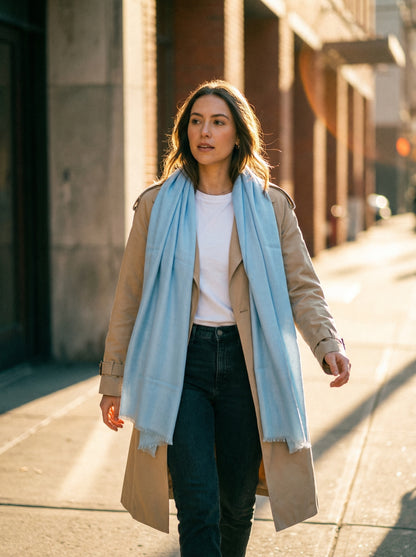 Light sky blue Tagelmust styled as a lightweight safari scarf for women, Touareg inspired Moroccan travel shawl for sun protection.