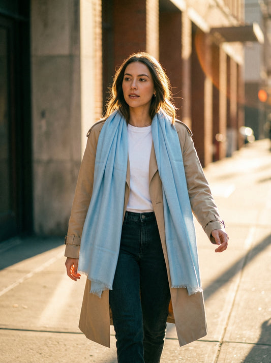 Light sky blue Tagelmust styled as a lightweight safari scarf for women, Touareg inspired Moroccan travel shawl for sun protection.