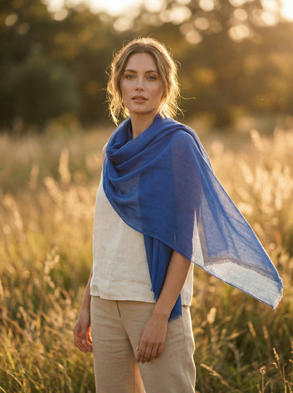 Original Indigo Tagelmust styled as a lightweight safari scarf for women, Touareg inspired desert headscarf for warm climate exploration.