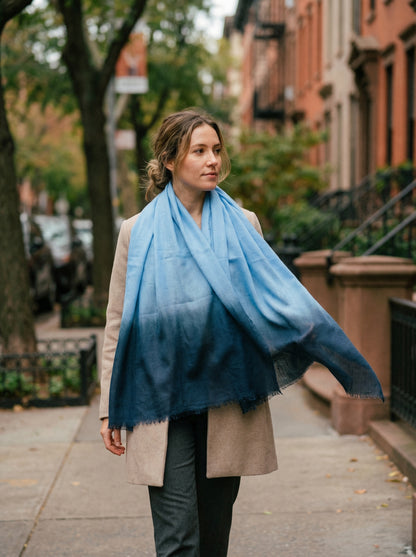 Light sky blue Tagelmust styled as a lightweight safari scarf for women, Touareg inspired Moroccan travel shawl for sun protection.