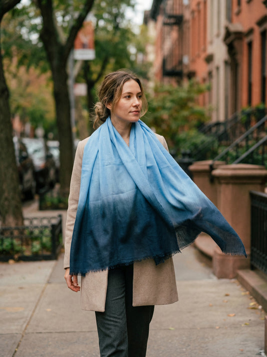 Light sky blue Tagelmust styled as a lightweight safari scarf for women, Touareg inspired Moroccan travel shawl for sun protection.