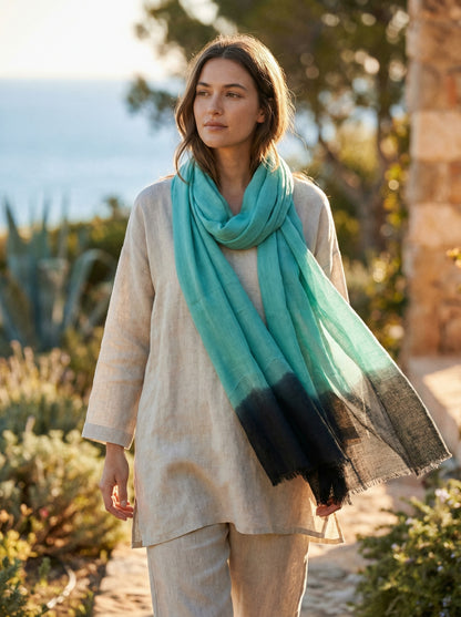 Keppel green Tagelmust styled as a lightweight travel scarf for women, Touareg inspired Moroccan headscarf for Sahara adventures.