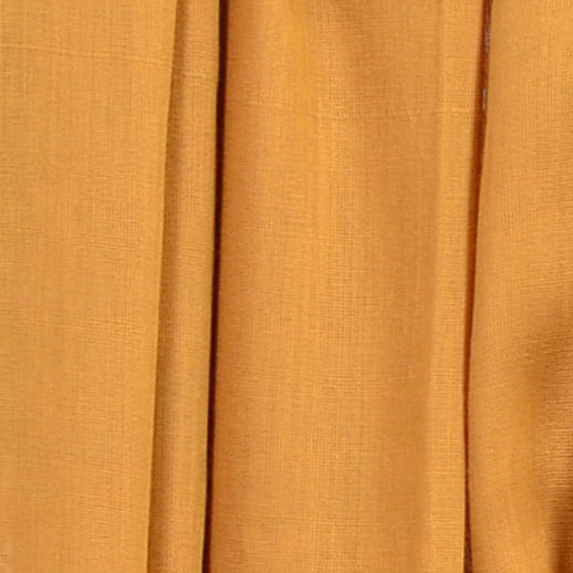 Close‑up of Harvest Gold Soaked Tagelmust scarf fabric – warm mustard‑gold Moroccan headscarf, sustainably sourced lightweight weave ideal for nomadic travelers searching for gold, mustard, or yellow scarves for hot‑weather, dry‑climate adventures.