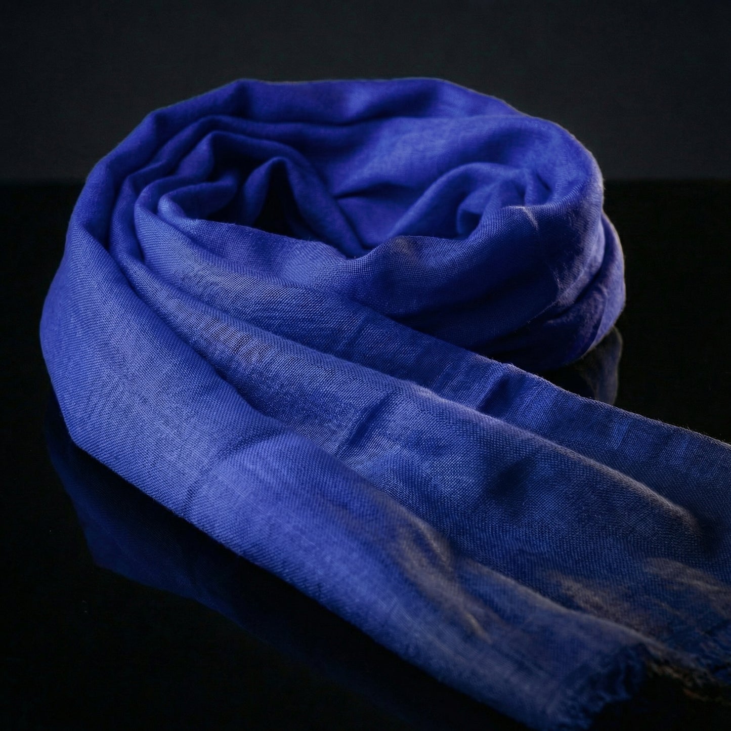 Sustainably sourced Nomad Tagelmust in violet tone, ideal safari scarf for sun and dust defense.