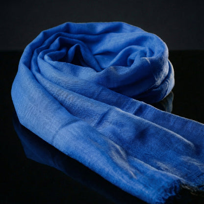 Lightweight indigo blue Tagelmust in rayon fabric, designed as a breathable desert headscarf for Sahara travel and Safari.