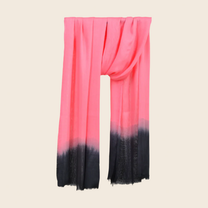 Rose Pompadour Soaked Tagelmust scarf – bright coral‑pink hanging wrap fading to deep black gradient. Sustainably sourced lightweight Moroccan headscarf perfect for nomadic travelers searching for pink, coral, or black scarves for hot‑weather, dry‑climate adventures.