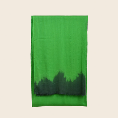 Keppel Green Soaked Tagelmust scarf – vibrant emerald green fading to deep forest‑black, sustainably sourced lightweight Moroccan headscarf ideal for nomadic travelers seeking green scarves for hot weather and dry climates.
