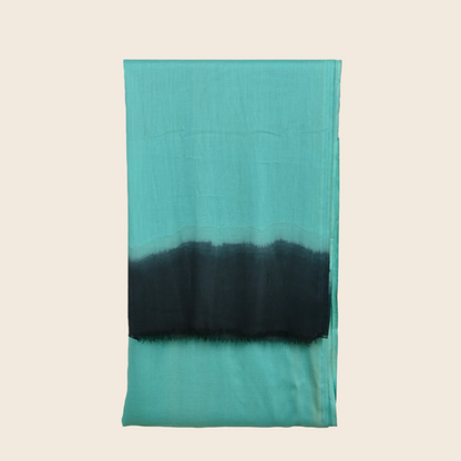 Sea Green Soaked Tagelmust scarf – vibrant sea‑green / teal fading to deep black. Sustainably sourced, lightweight Moroccan headscarf perfect for nomadic travelers searching for teal, sea‑green, or black scarves for hot‑weather, dry‑climate adventures.
