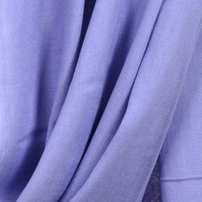 Close‑up of Vista Blue Soaked Tagelmust scarf fabric – soft lavender‑blue Moroccan headscarf, sustainably sourced lightweight weave ideal for nomadic travelers searching for lavender, periwinkle, or light‑blue scarves for hot‑weather, dry‑climate adventures.